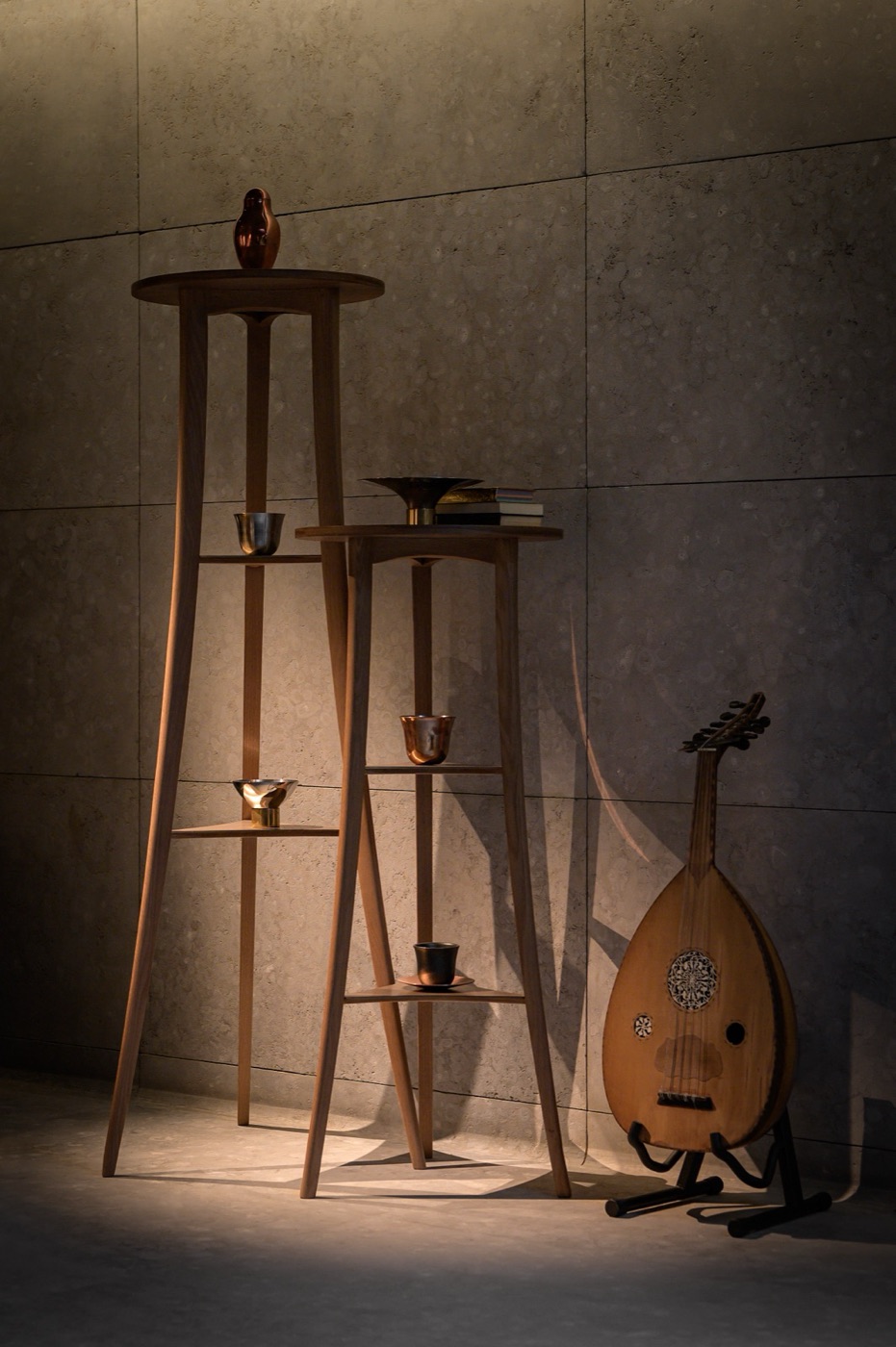 Turned wooden stands holding small vessels in low light, an oud resting alongside